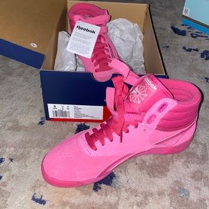 New Reebok high top classic pink sneakers.